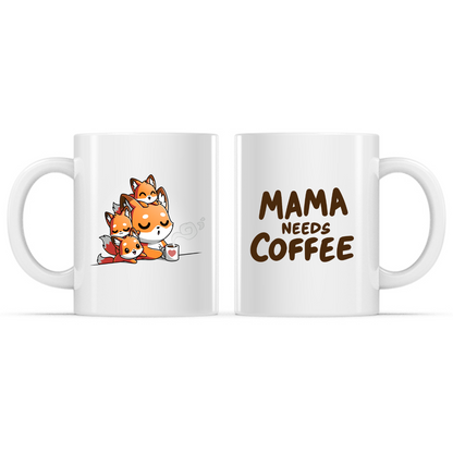Ceramic Mug_TeeTurtle Mama Needs Coffee white mug featuring a mother fox holding a cup of coffee with her kits surrounding her, with the caption, “Mama Needs Coffee“.