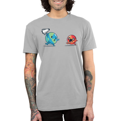A man wearing a gray T-shirt with a red TeeTurtle ball and a blue TeeTurtle ball is prepared for the Mars Invasion.