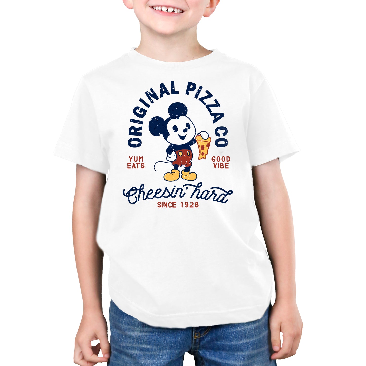 A boy wearing a licensed Disney Mickey's Pizza Company T-shirt.