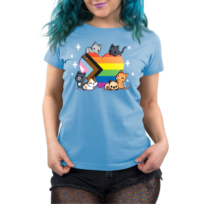 Premium Cotton T-shirt_TeeTurtle light blue Progress Purride Premium Cotton T-shirt featuring six different cats on or around a heart that is the colors of the progress pride flag. There are sparkles around them and all the cats look happy. 