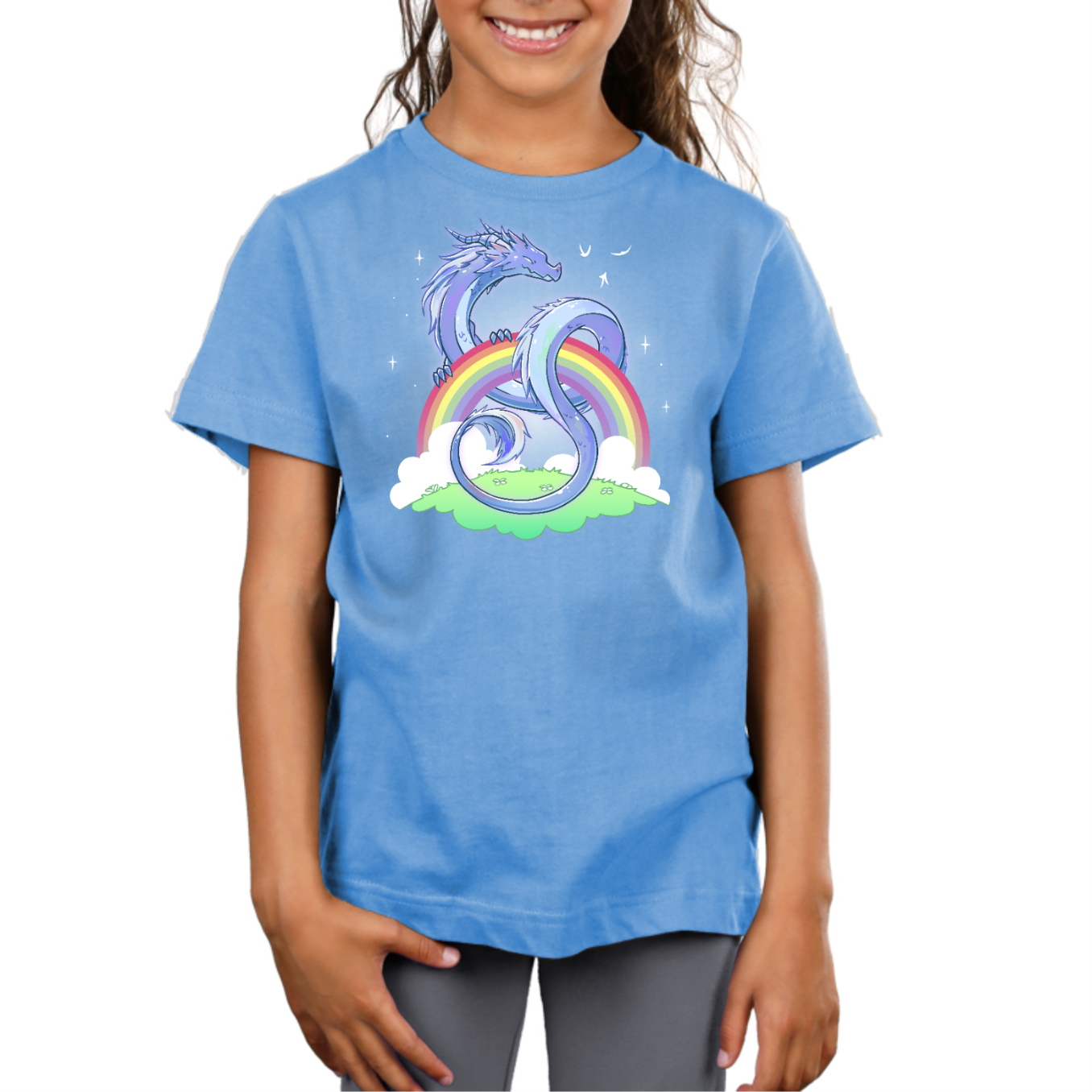 Premium Cotton T-shirt_TeeTurtle light blue Rainbow Protector Premium Cotton T-shirt featuring a smiling dragon protectively looped around a rainbow above a grassy area. There are sparkles around the dragon and rainbow. 
