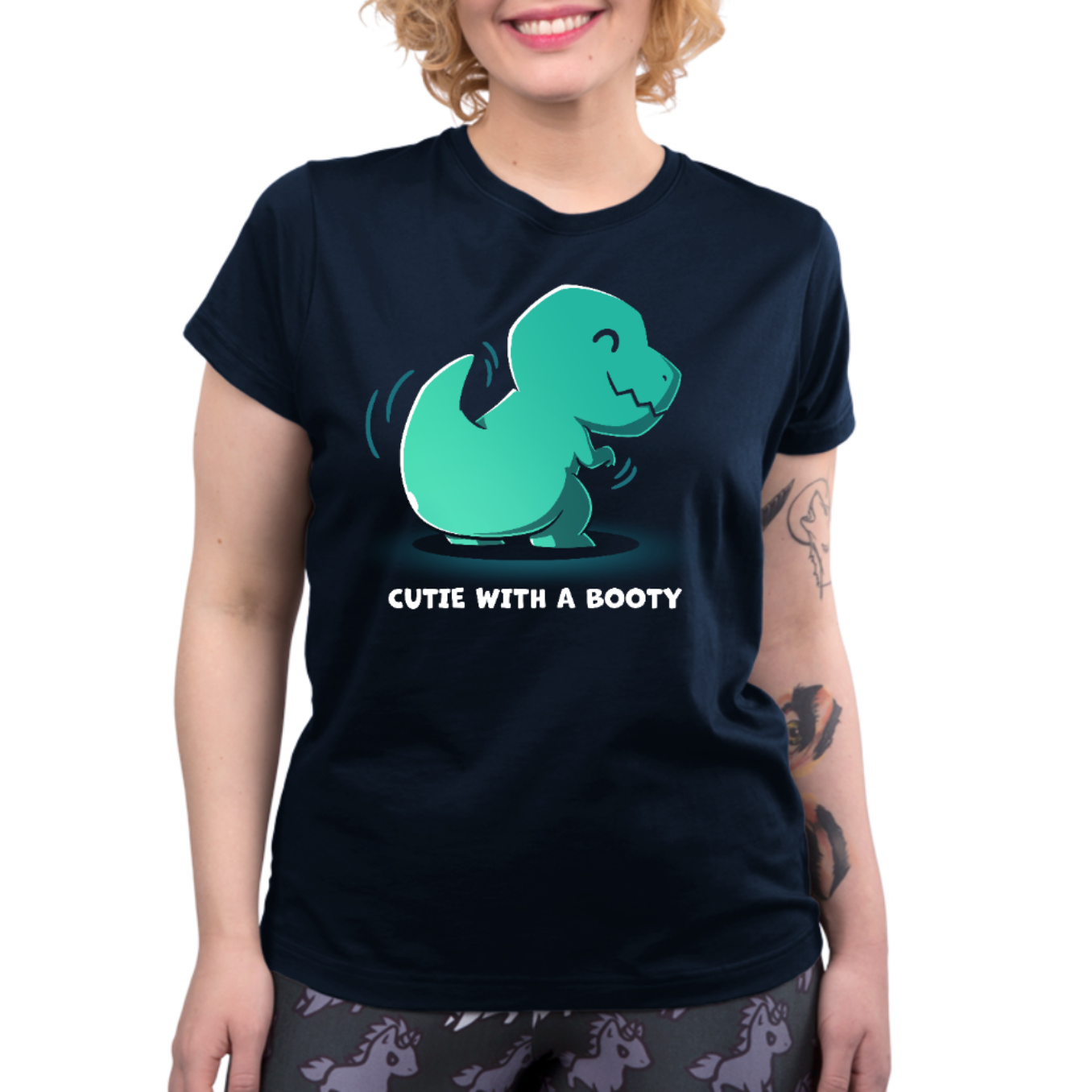 Premium Cotton T-shirt_TeeTurtle navy Cutie With a Booty Premium Cotton T-shirt featuring a happy green t-rex dinosaur wiggling its booty along with the text "Cutie With a Booty" 
