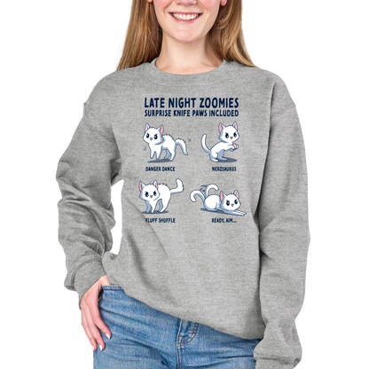 Crew Neck Sweatshirt_TeeTurtle light gray Late Night Zoomies Crew Neck Sweatshirt featuring four energetic white cats in different playful poses with the text "Late Night Zoomies, Surprise Knife Paws Included" and labels "Danger Dance," "Nekosaurus," "Fluff Shuffle," and "Ready, Aim..."