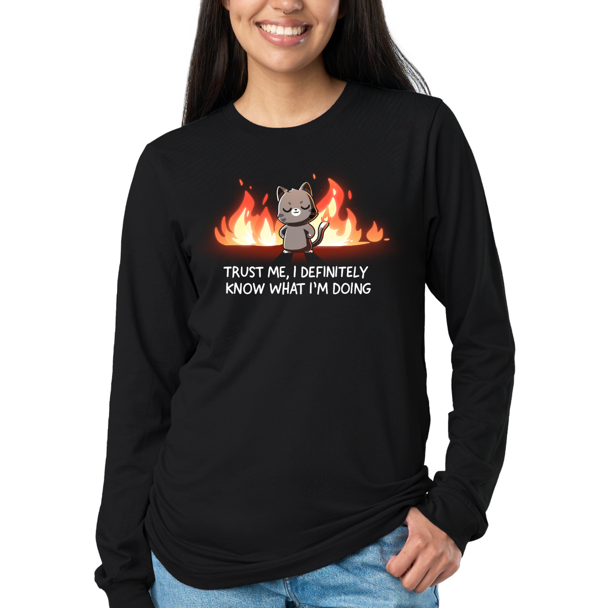 Long Sleeve T-shirt_TeeTurtle black I Definitely Know What I'm Doing Long Sleeve T-shirt featuring a smug gray cat standing confidently in front of bright flames with the text "Trust Me, I Definitely Know What I'm Doing."