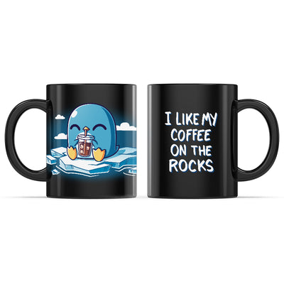 Ceramic Mug_TeeTurtle I Like My Coffee on the Rocks black mug featuring a penguin drinking coffee on an iceberg.