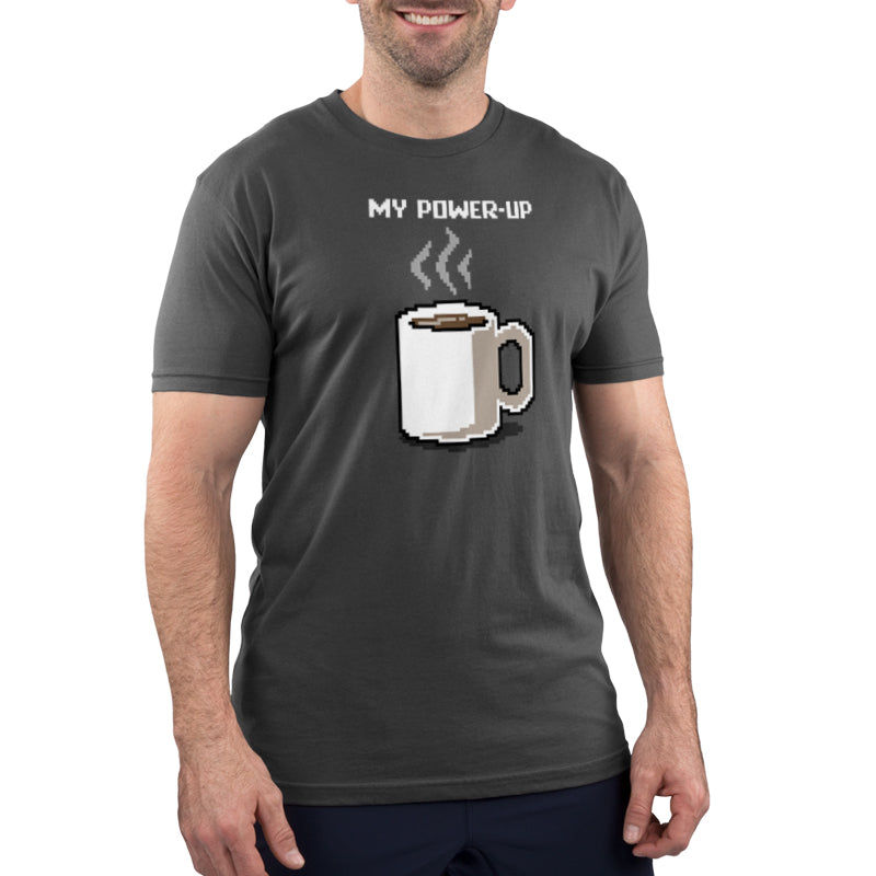 A man wearing a charcoal gray TeeTurtle t-shirt advertising his caffeine addiction with the phrase "my coffee is up" for My Power-Up.