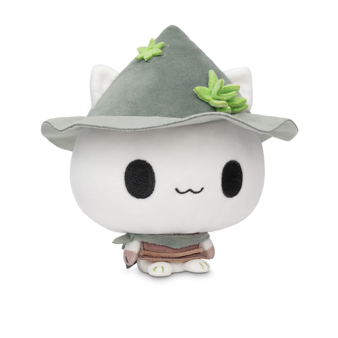 Cloudheads: 5" Mystic Moon (Fern). A cute white plush cat with large black eyes, a small wavy smile, wearing a gray pointed hat with green leaf accents and a brown skirt, photographed on a clean white background.