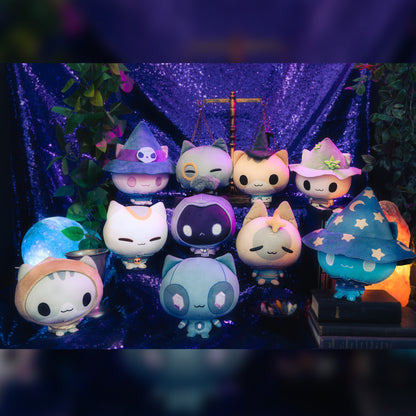 Mystic Moon Cloudheads Bundle - Bundle features all 10 cat witch character Cloudheads from our game Mystic Moon. This image shows the Cloudheads in front of a purple background surrounded by leaves, with a crystal ball, old books, vintage scale and salt lamp visible. 