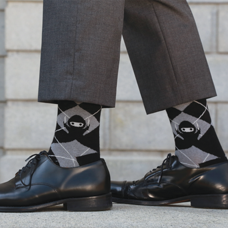 Black and grey Business Ninja socks from TeeTurtle offering both style and comfort.