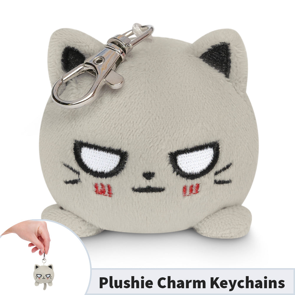 A portable TeeTurtle Cat Plushie Charm Keychain (Light Gray) adorned with a pushy plushie charm.