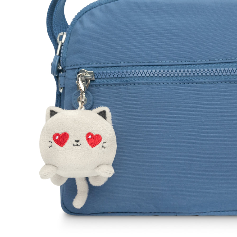 A portable TeeTurtle blue bag with a TeeTurtle Cat Plushie Charm Keychain (Light Gray Love) attached to it.