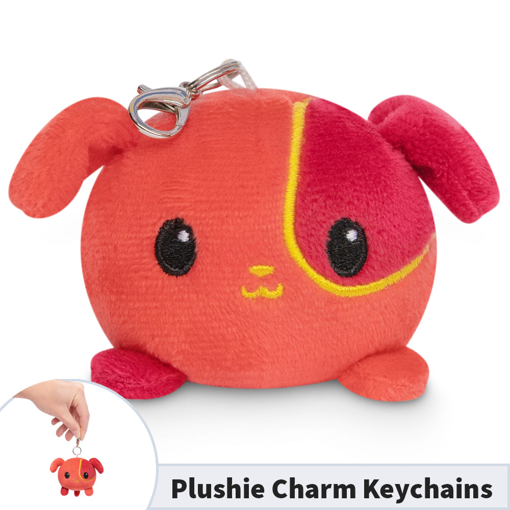 A TeeTurtle Lunar New Year Dog Plushie Charm Keychain with the words 'plushie charm keychain' that is perfect for Lunar New Year celebrations.