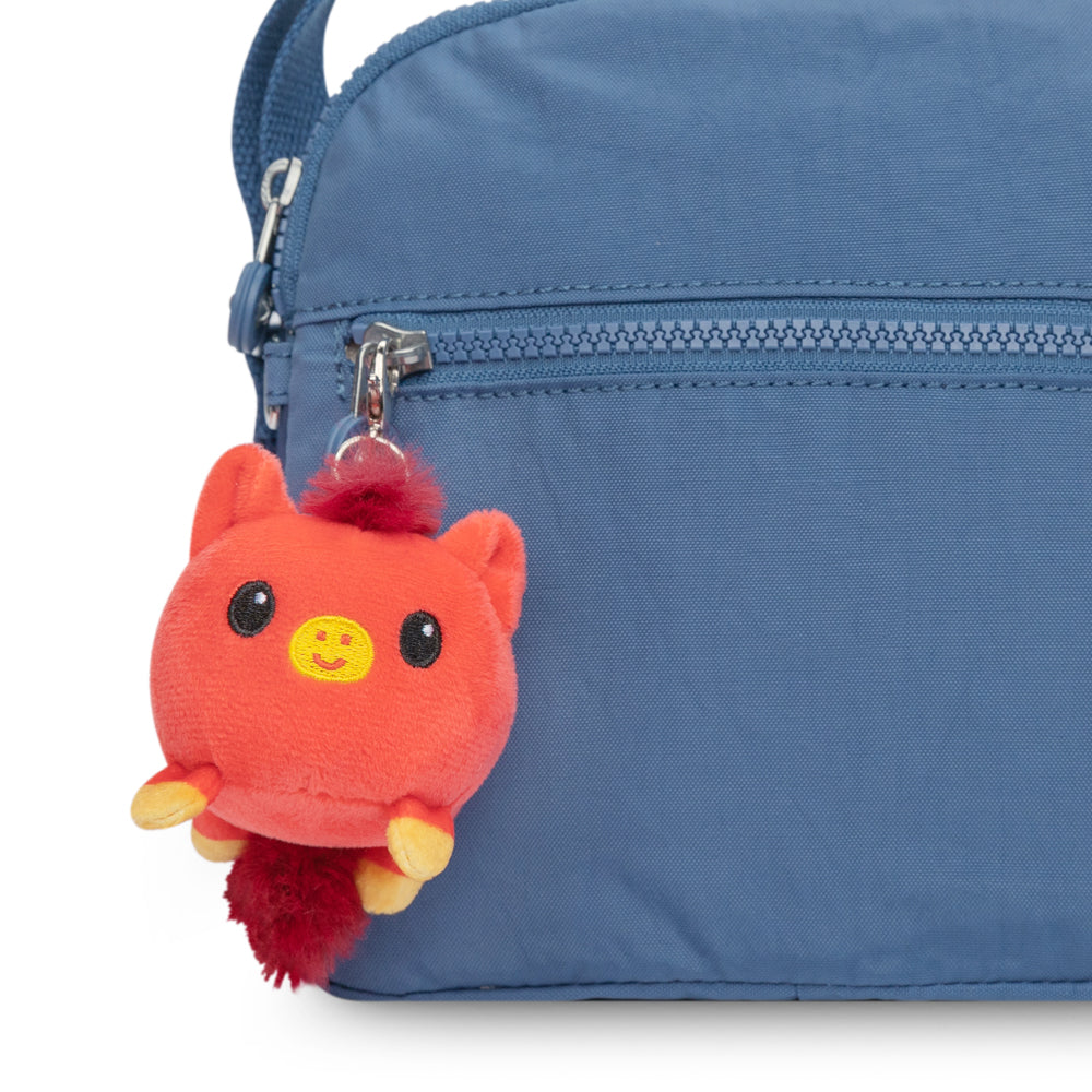 A blue bag with a TeeTurtle Lunar New Year Horse Plushie Charm Keychain attached to it, perfect for the Lunar New Year celebrations.