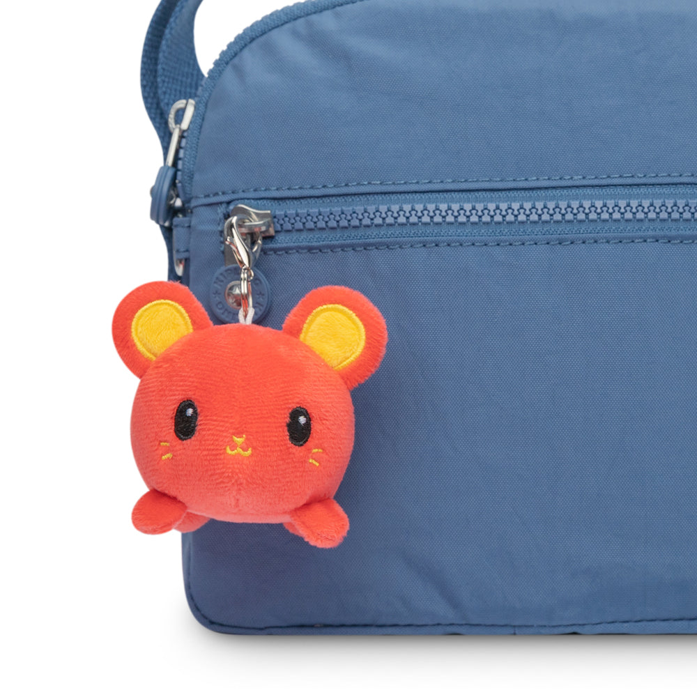 A blue bag with a TeeTurtle Lunar New Year Rat Plushie Charm Keychain attached to it.