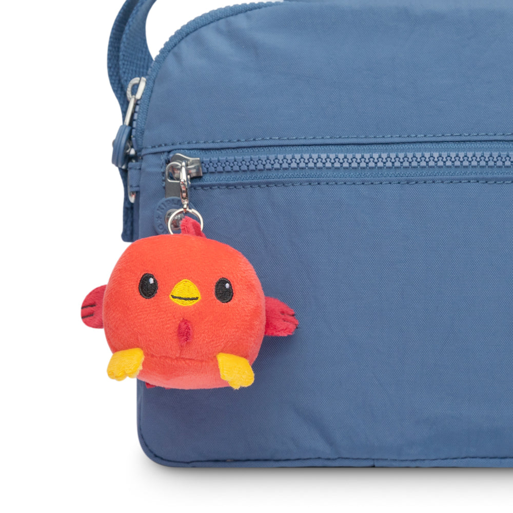 A blue bag with a red TeeTurtle Lunar New Year Rooster Plushie Charm Keychain attached to it, perfect for a collection of Plushie Charm Keychains.