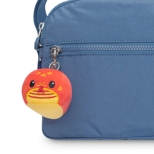 A TeeTurtle Lunar New Year collection of blue bags with TeeTurtle Snake Plushie Charm Keychains attached.
