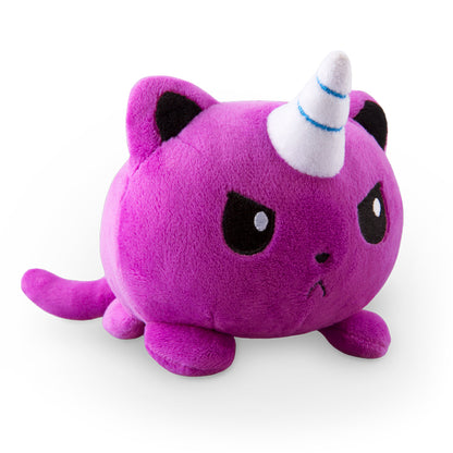 An angry purple cat with a TeeTurtle Kittencorn Plushie hat on its head that loves snuggles.