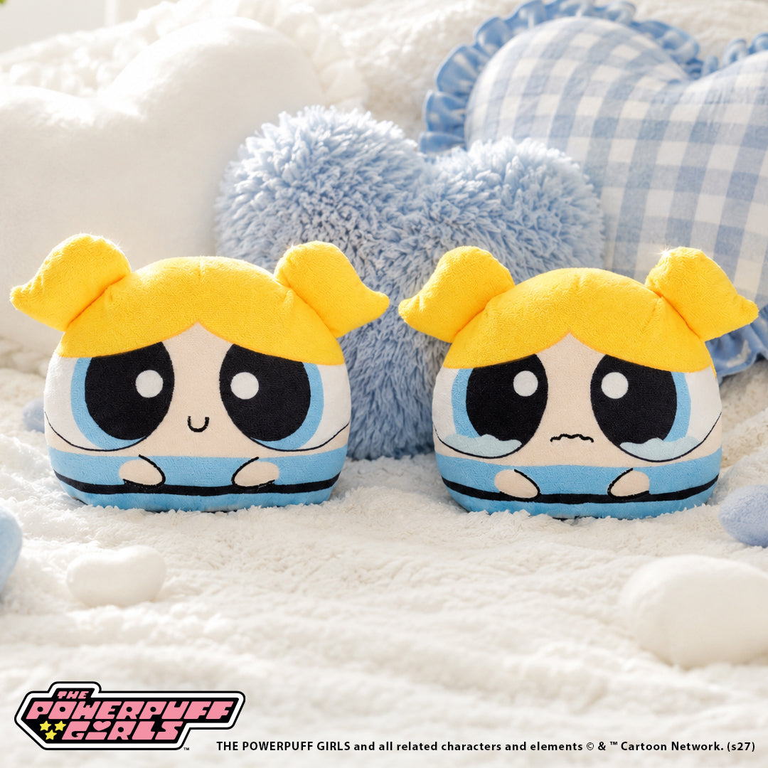 Bubbles 4-inch reversible plush with blonde pigtails, blue outfit, and a sad expression.