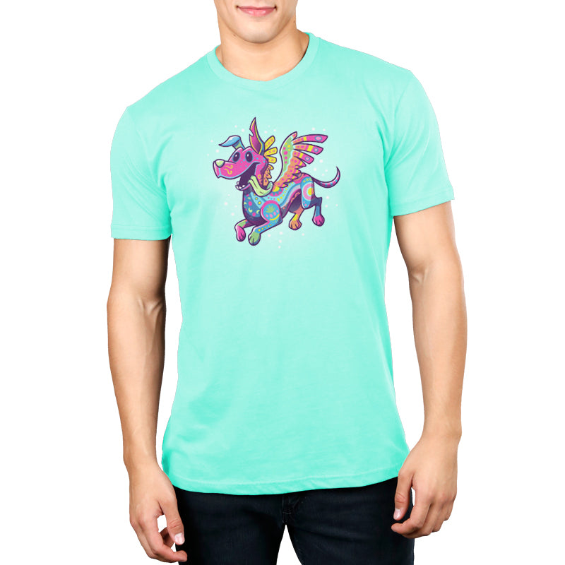 A man wearing an officially licensed Pixar Coco turquoise t-shirt featuring Dante the Alebrije.