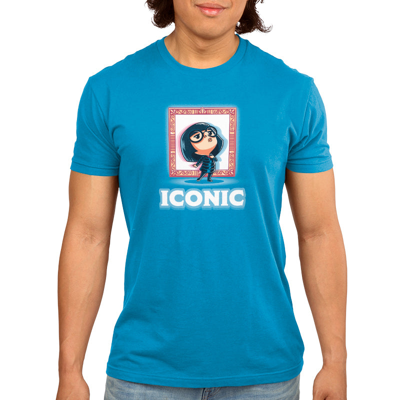 A man wearing a blue t-shirt with the iconic Edna Mode logo from Disney.