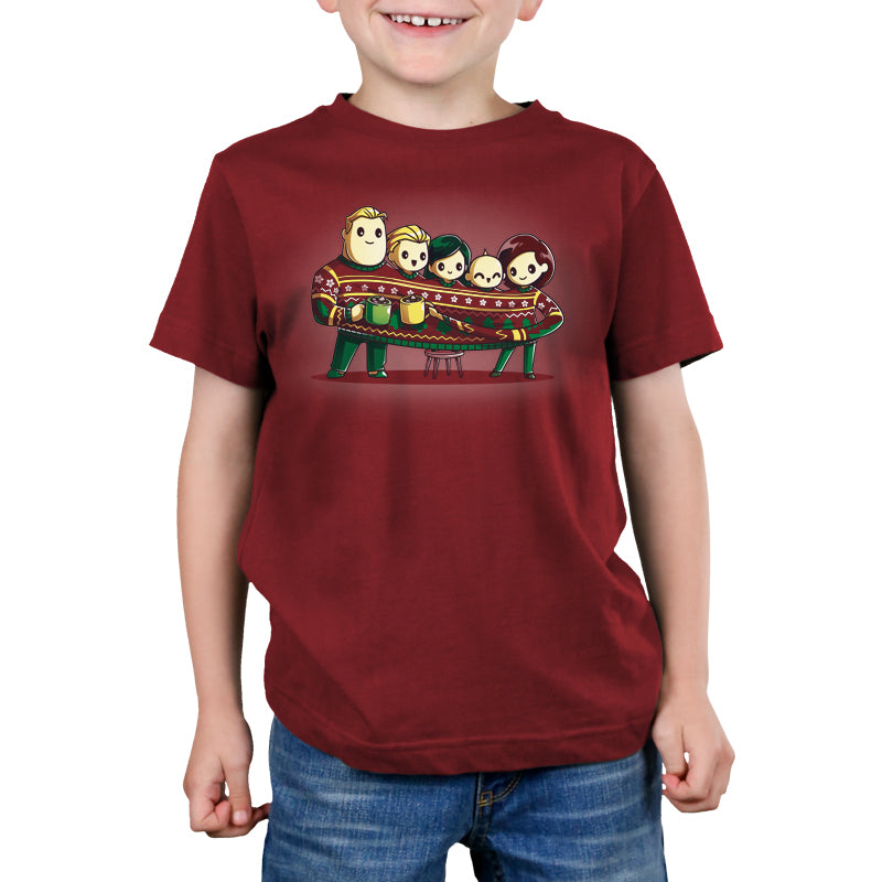 A kid wearing a red t-shirt with cartoon characters, Pixar's The Incredibles Family Holiday Sweater.