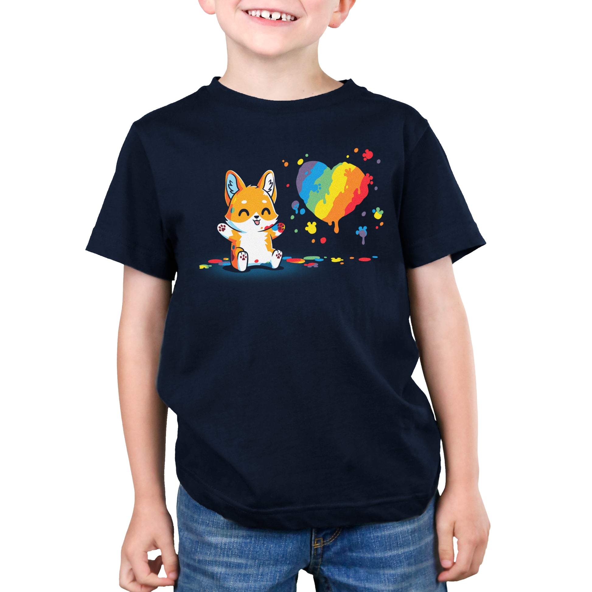 A young boy wearing a Paw Painting (Corgi) t-shirt by TeeTurtle.