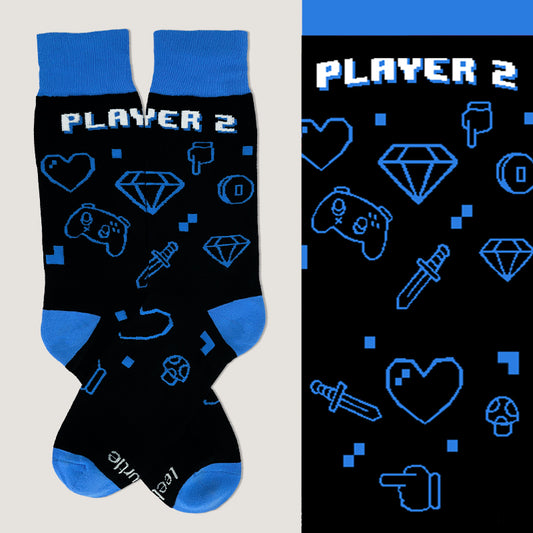 A comfortable pair of TeeTurtle Player 2 Socks with the words player 2 on them.