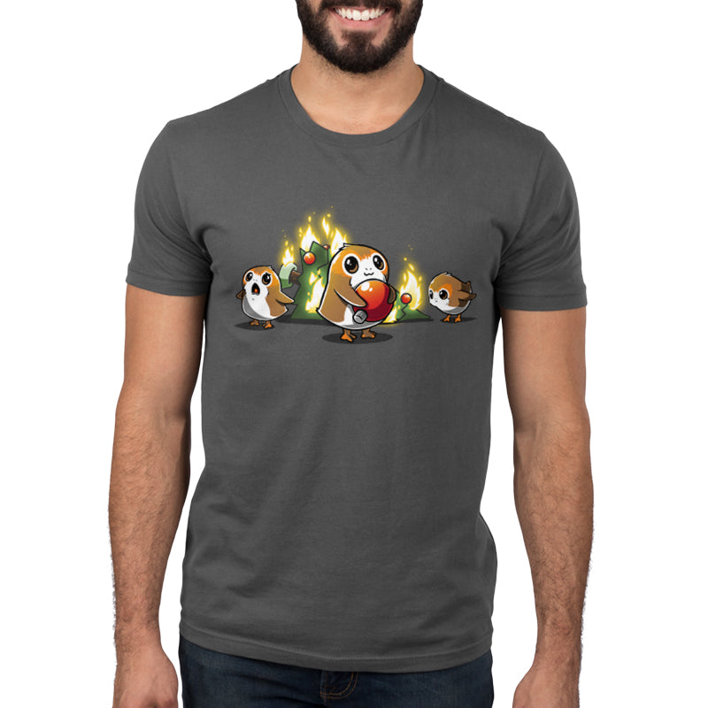 A man wearing a Star Wars Porg Christmas t-shirt with two guinea pigs.
