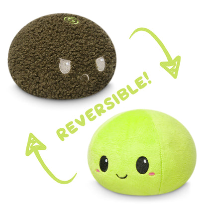 Two TeeTurtle plush toys, including a TeeTurtle Reversible Avocado Plushie and mood plushies.