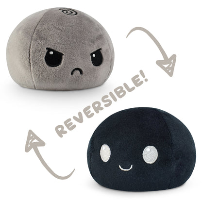 A TeeTurtle Reversible Ball Plushie (Gray + Black) with the words "reversible" on it, designed by TeeTurtle.