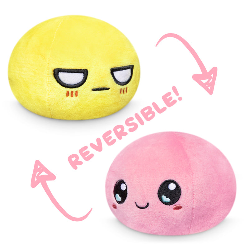 The TeeTurtle Reversible Ball Plushie (Yellow + Pink) is a delightful mood plushie that features a charming combination of pink and yellow colors. This adorable plush ball is not only soft and cuddly but also perfect for playtime.