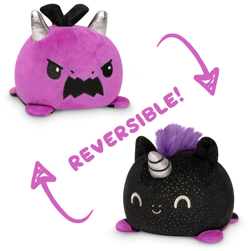 Two black and purple plush toys, the TeeTurtle Reversible Dragon & Unicorn Plushie (Purple + Black Sparkle), created by TeeTurtle.