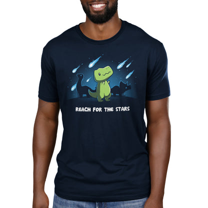 A man wearing a navy blue T-shirt that says Reach for the Stars (T-Rex) by TeeTurtle.