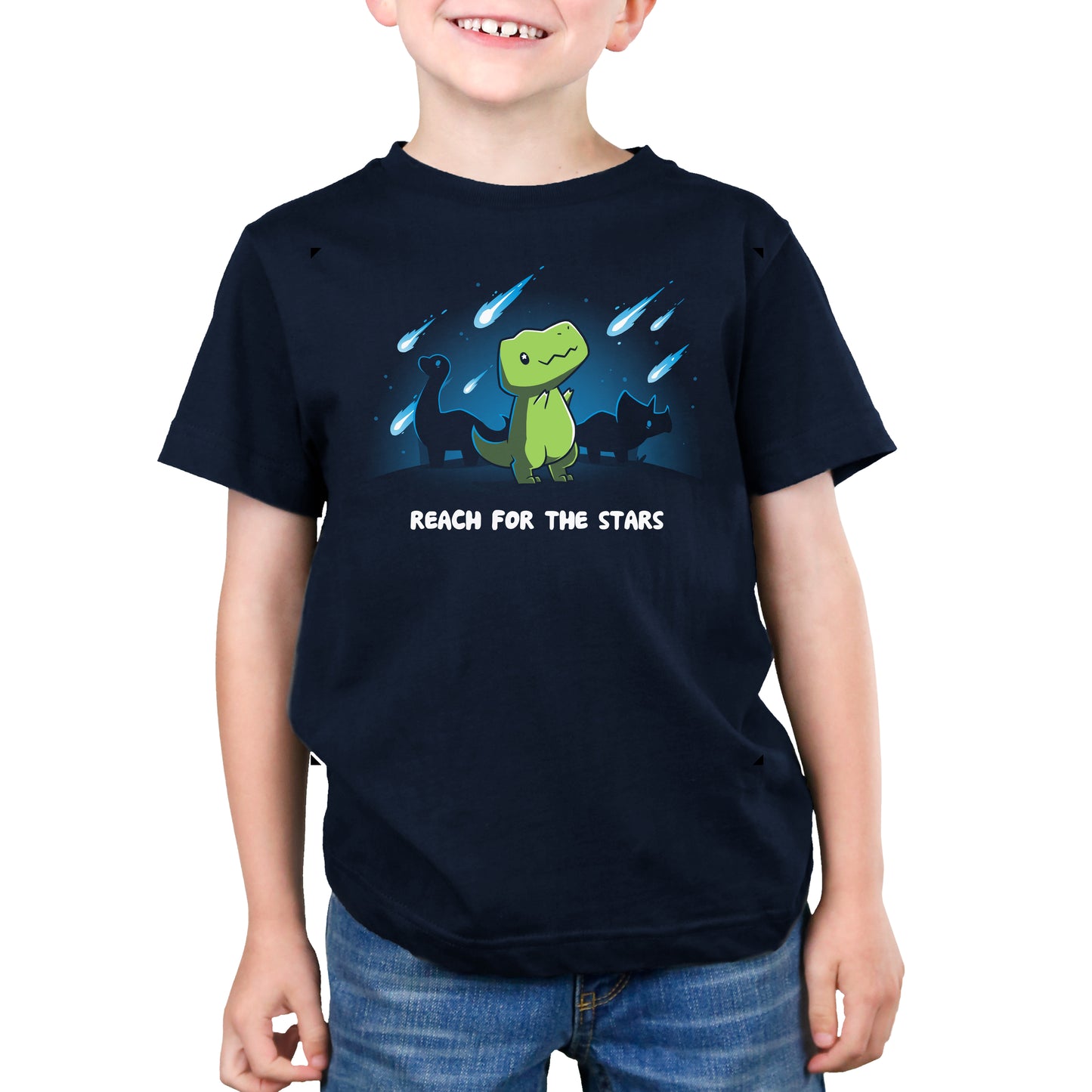A boy wearing a Reach For The Stars (T-Rex) t-shirt from TeeTurtle.
