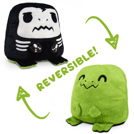 This TeeTurtle Reversible T-Rex Plushie (Skeleton) features a reversible design with a black and green skeleton, perfect for those who love mood plushies.