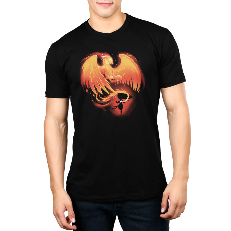 A man wearing a licensed Marvel - Deadpool/X-Men black t-shirt featuring the Rise of the Phoenix design.