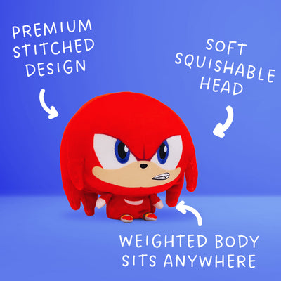 Knuckles Cloudhead plushie with Mom's Choice Award seal. He has a big head, tiny body and a determined expression on his face. Around him are arrows with text that say "premium stitched design," "soft squishable head" and "weighted body sits anywhere" 