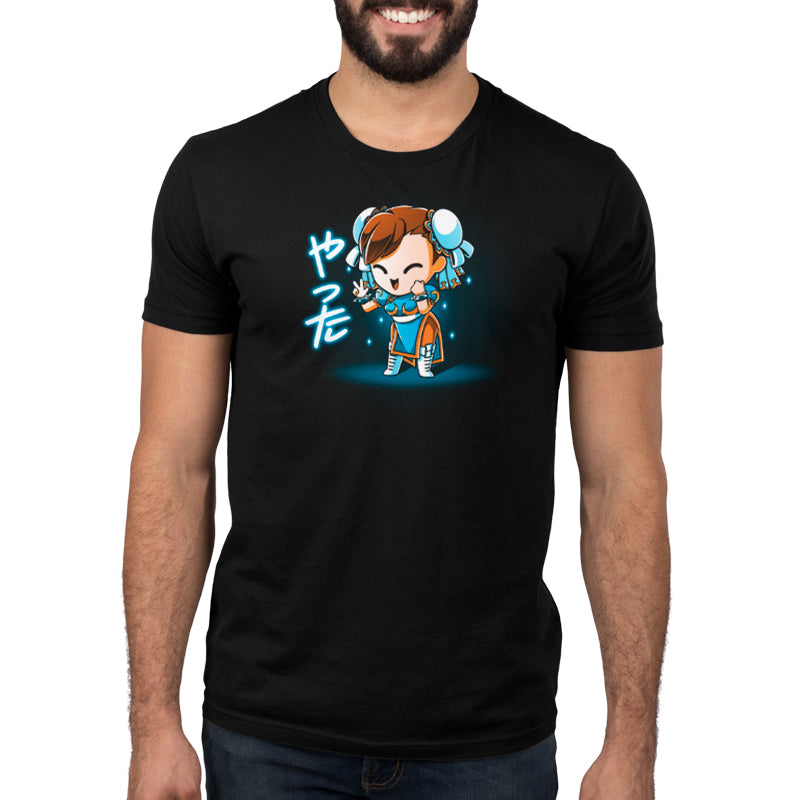 A man wearing a black t-shirt with Chibi Chun-Li, a Street Fighter character, on it.