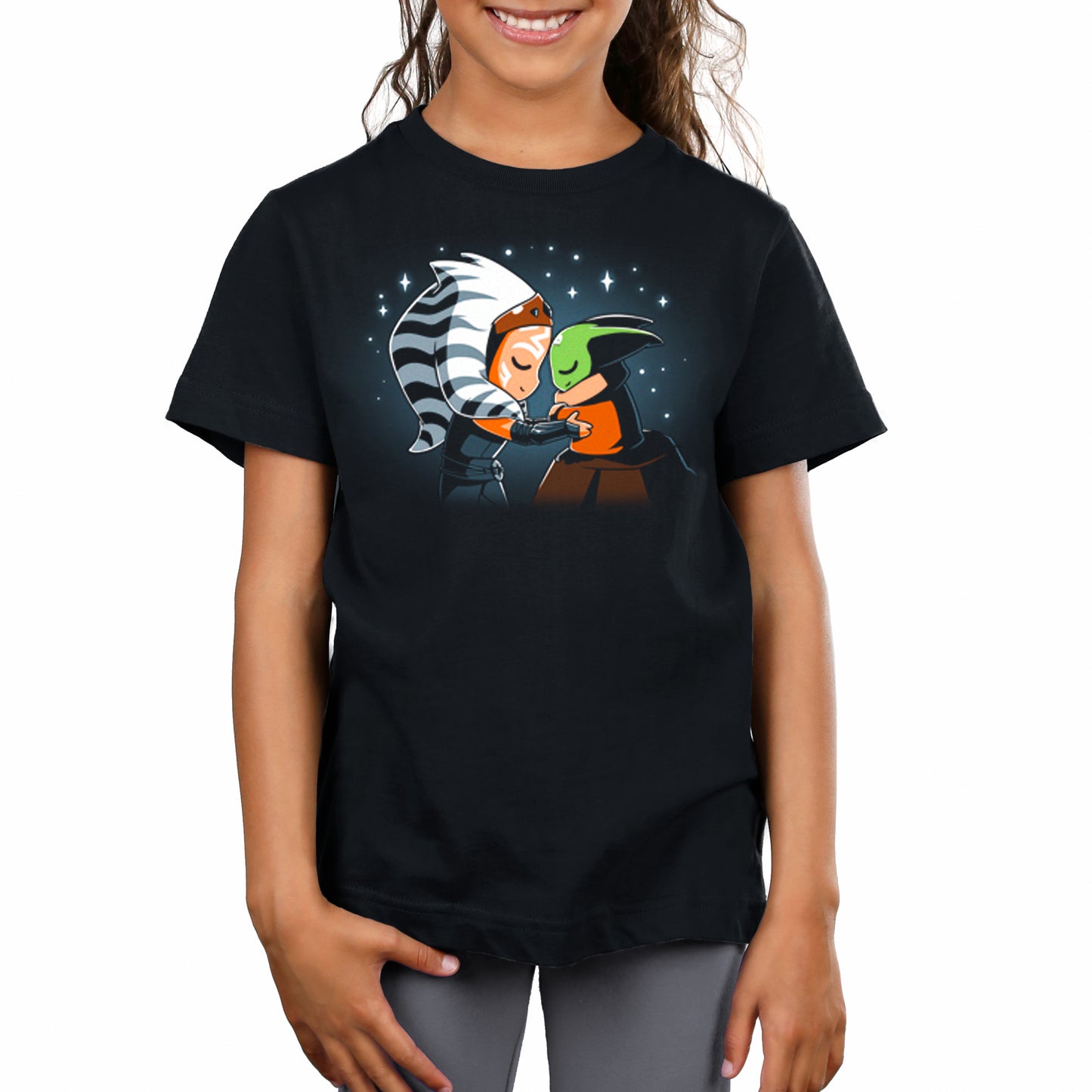 A girl wearing an officially licensed black T-shirt with a Star Wars Force Telepathy image.