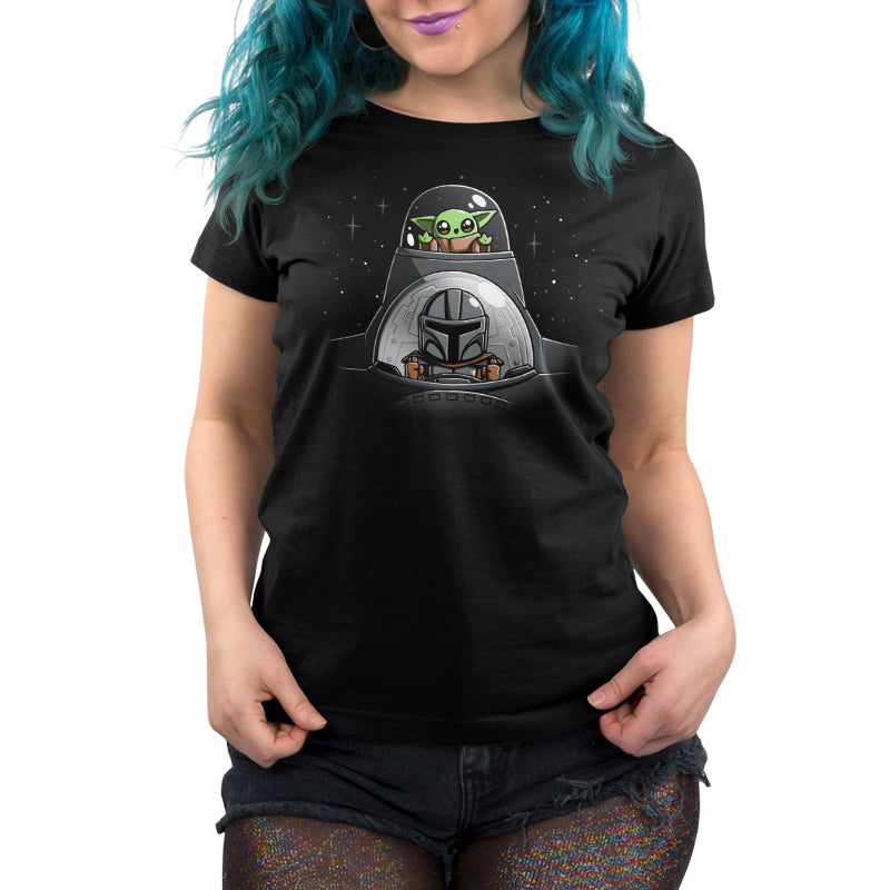 A woman joyfully wears an official licensed Mando and Grogu's N-1 Adventure black t-shirt featuring a spaceship image by Star Wars.