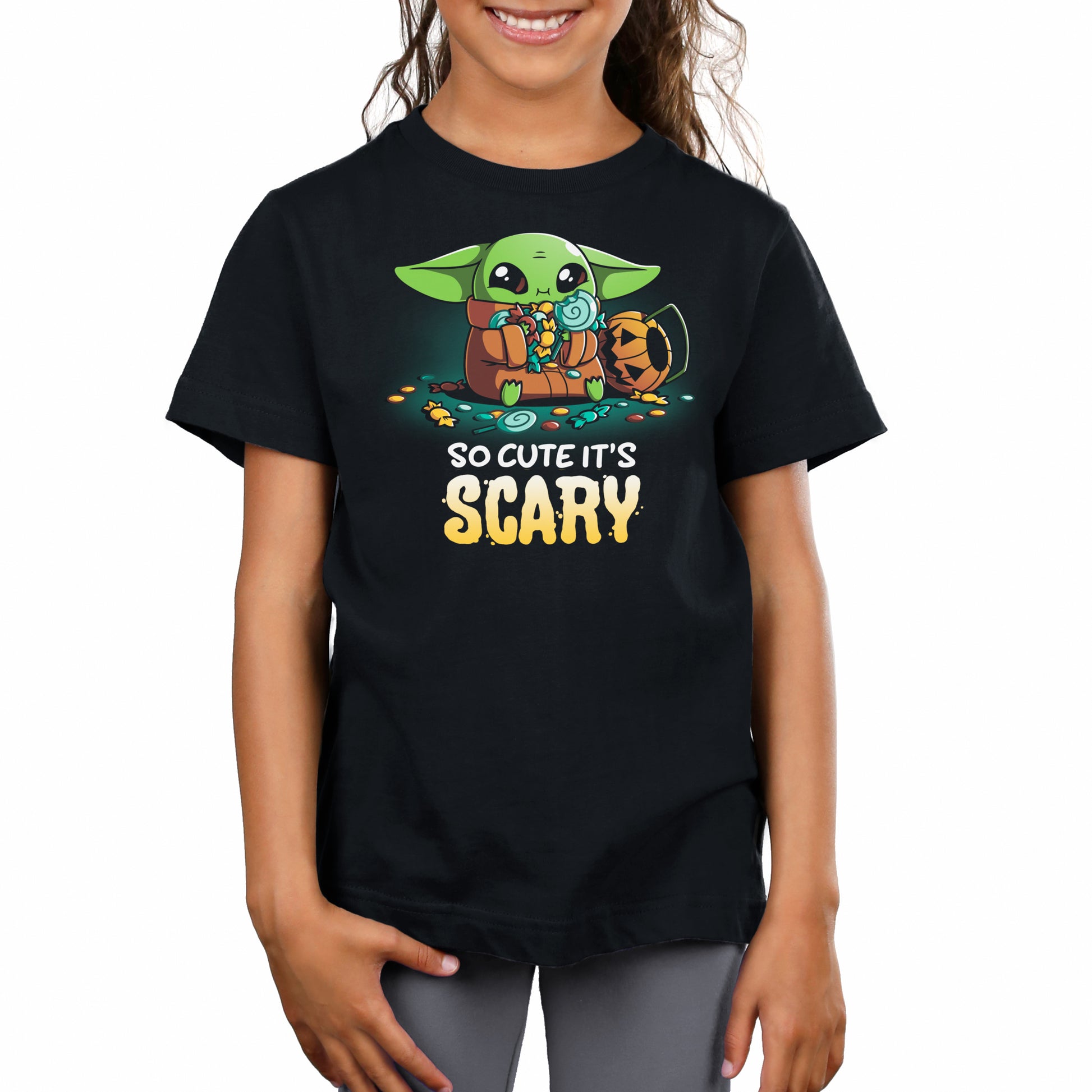 A girl wearing a So Cute It's Scary t-shirt, showing off her Star Wars obsession.