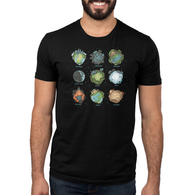 A man wearing a black t-shirt with Star Wars Planets on it, by the brand Star Wars.