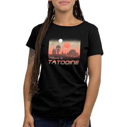 A woman wearing a black t-shirt with the words "Welcome to Tatooine" tattooed on it, made by Star Wars.