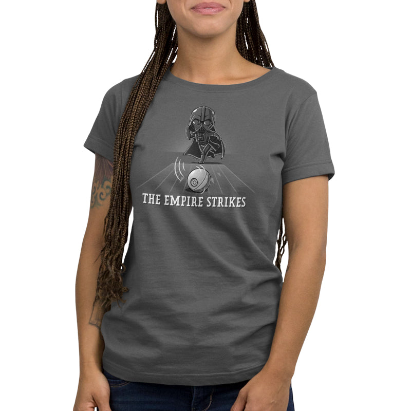 A woman wearing an officially licensed Star Wars Darth Vader t-shirt that says The Empire Strikes.