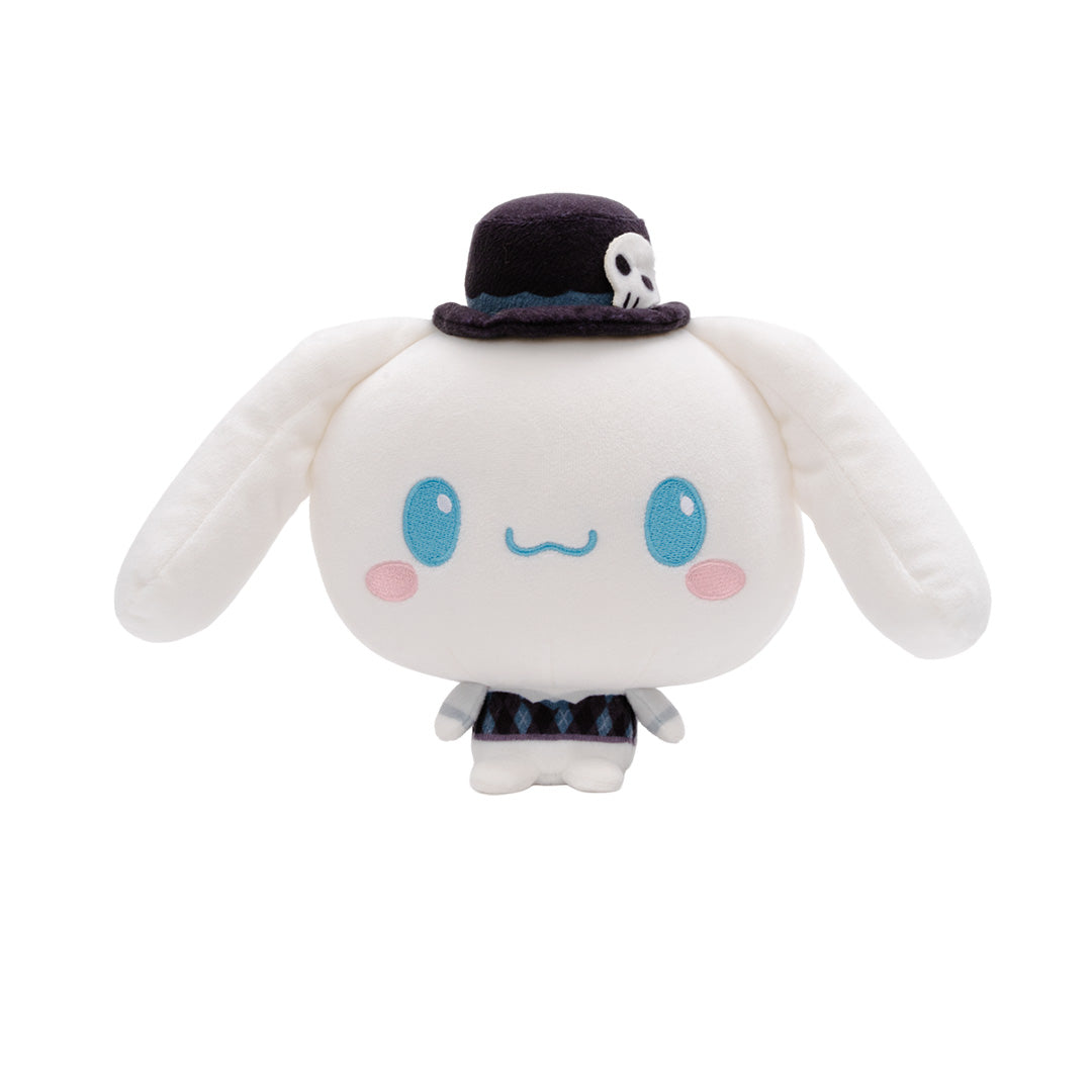 A Cinnamoroll Cloudheads plushie with long floppy ears, blue eyes, pink cheeks, and a small dark top hat with a skull detail, shown on a plain white background. 