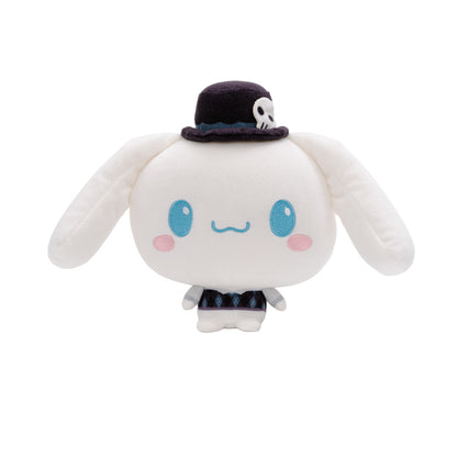 A Cinnamoroll Cloudheads plushie with long floppy ears, blue eyes, pink cheeks, and a small dark top hat with a skull detail, shown on a plain white background. 