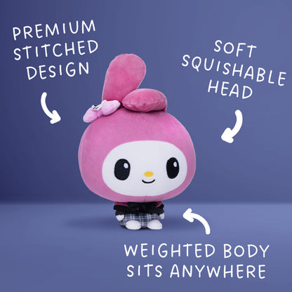 A pink My Melody Cloudheads plushie with a white face, black eyes, a small yellow nose, and a black-and-white plaid skirt, shown on a blue background with the text "Premium Stitched Desigh" "Soft Squishable Head" and "Weighted Body Sits Anywhere"