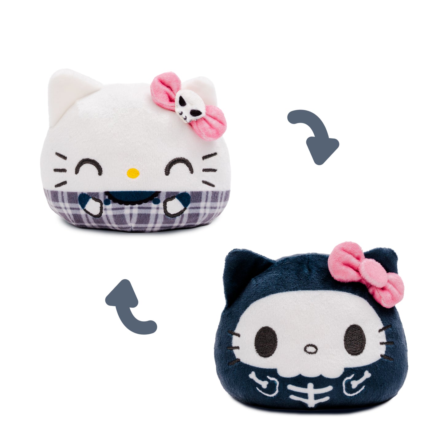 Hello Kitty reversible plush , one in a white skeleton outfit with a pink bow and the other in a dark navy skeleton outfit with a pink bow