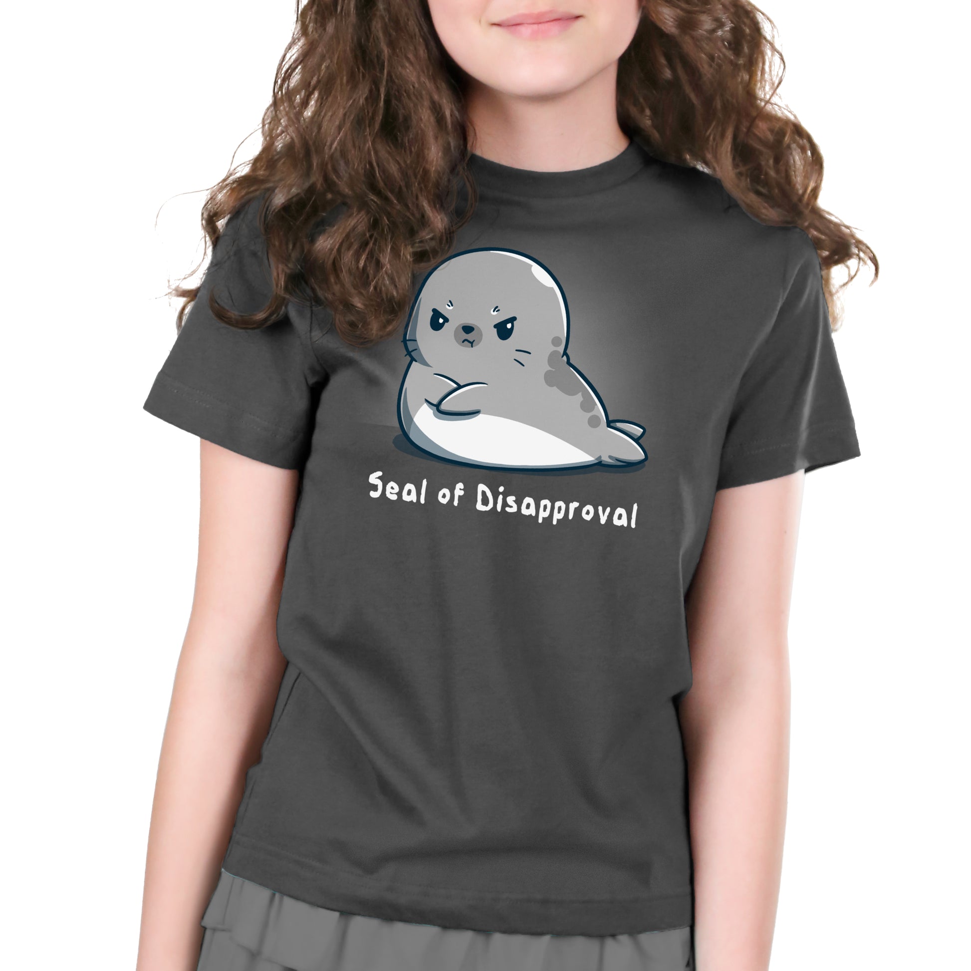 A disapproving girl wearing a TeeTurtle Seal of Disapproval charcoal gray t-shirt.