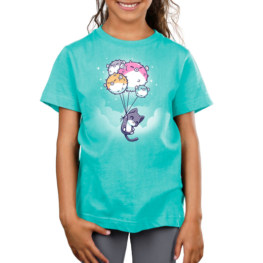 A girl wearing a Sky High t-shirt from TeeTurtle with a cat on a balloon.